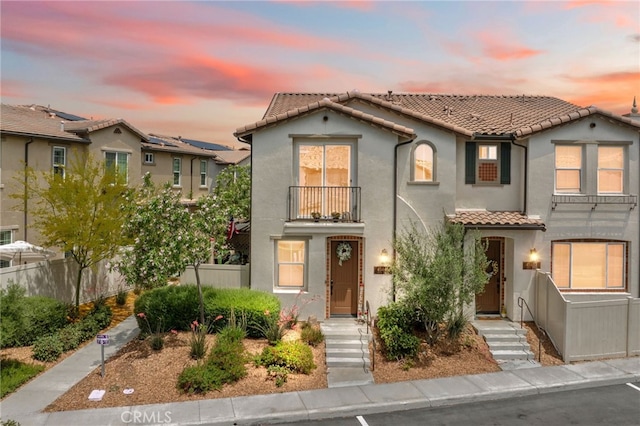 45445 Calle Cirros, Temecula, CA 92592 - view of front facade featuring a balcony, a tile roof, and stucco siding