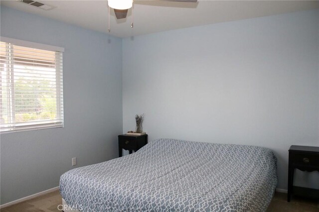38564 Pallas Ct, Palmdale, CA 93551 - carpeted bedroom with baseboards and a ceiling fan
