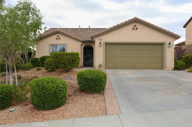 38564 Pallas Ct, Palmdale, CA 93551 - mediterranean / spanish home with stucco siding, driveway, a tile roof, and an attached garage