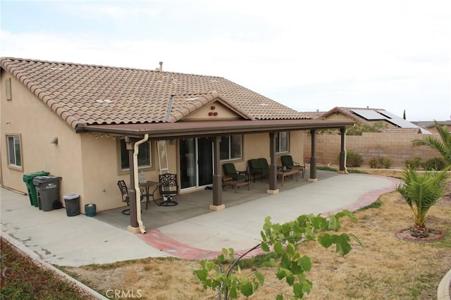 38564 Pallas Ct, Palmdale, CA 93551 - rear view of house with stucco siding, a tiled roof, and a patio