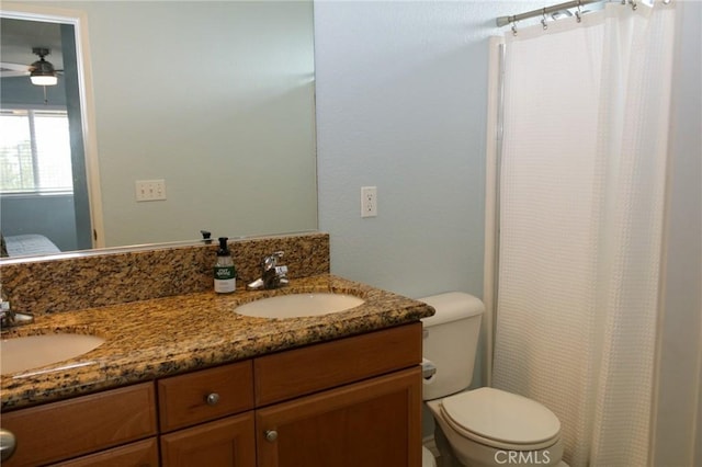 38564 Pallas Ct, Palmdale, CA 93551 - full bath featuring double vanity, toilet, a ceiling fan, and a shower with curtain