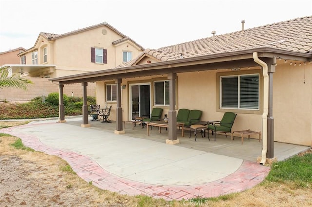 38564 Pallas Ct, Palmdale, CA 93551 - back of house featuring a patio, a tile roof, and stucco siding