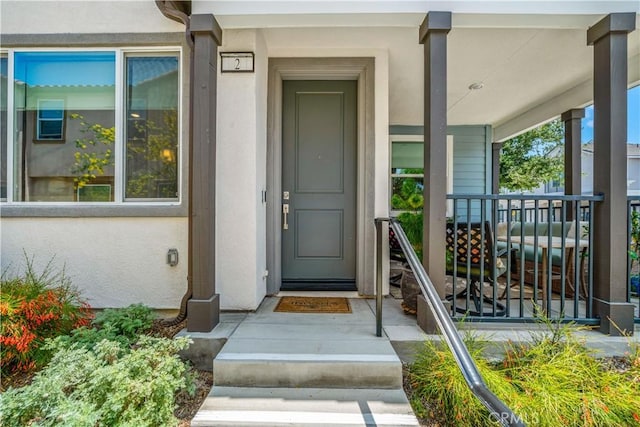 15210 Horizon St Unit 2, Fontana, CA 92336 - property entrance with stucco siding and a porch