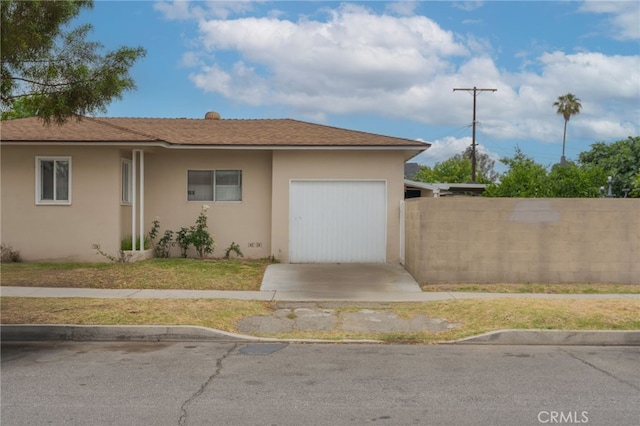6532 Bonnie Vale Ave, Pico Rivera, CA 90660 - view of front of house with stucco siding, a garage, and driveway