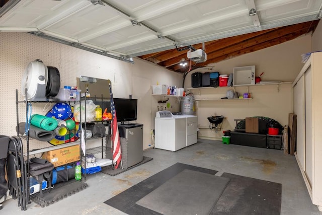 3673 Brandywine St, Oceanside, CA 92057 - garage with washing machine and clothes dryer, a garage door opener, and strapped water heater
