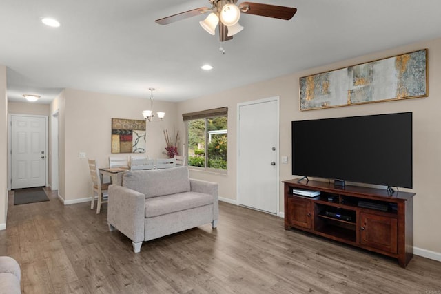 3673 Brandywine St, Oceanside, CA 92057 - living room featuring a chandelier, a ceiling fan, light wood-style flooring, and recessed lighting
