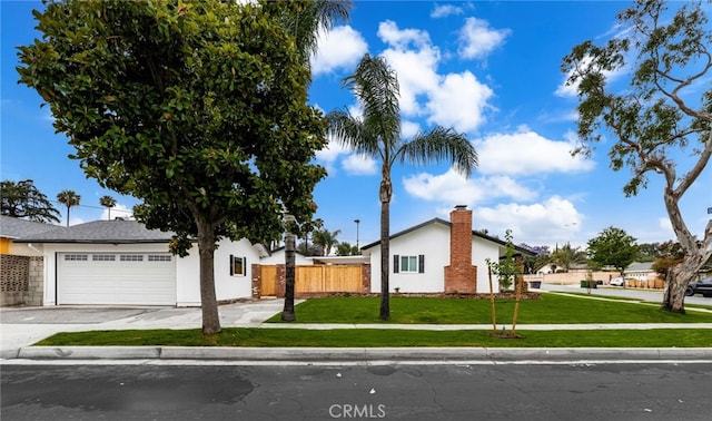 1905 Davis St, Corona, CA 92882 - view of front of house featuring a garage, concrete driveway, and stucco siding
