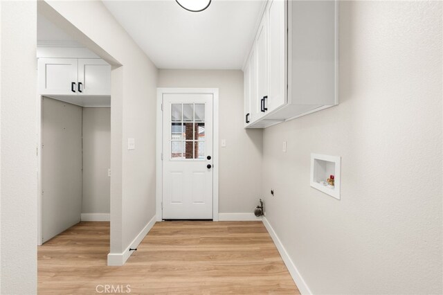 1905 Davis St, Corona, CA 92882 - laundry room with cabinet space, light wood-type flooring, washer hookup, hookup for an electric dryer, and baseboards