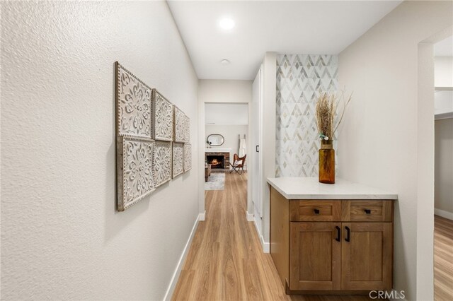 1905 Davis St, Corona, CA 92882 - corridor with light wood finished floors and baseboards