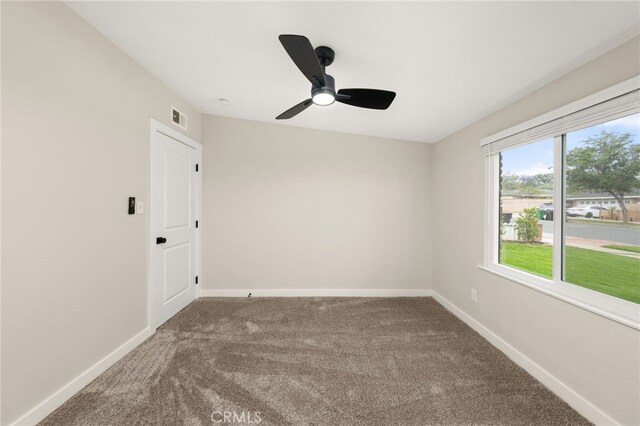 1905 Davis St, Corona, CA 92882 - carpeted empty room with baseboards and ceiling fan
