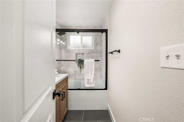 1905 Davis St, Corona, CA 92882 - bathroom featuring vanity, tile patterned floors, and combined bath / shower with glass door