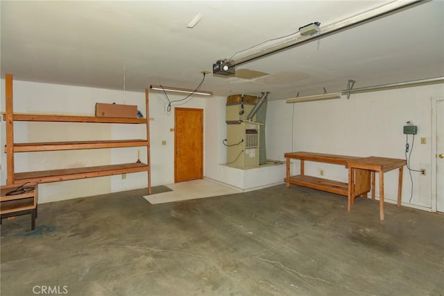 22478 Poppy Rd, Apple Valley, CA 92308 - garage featuring heating unit and a garage door opener