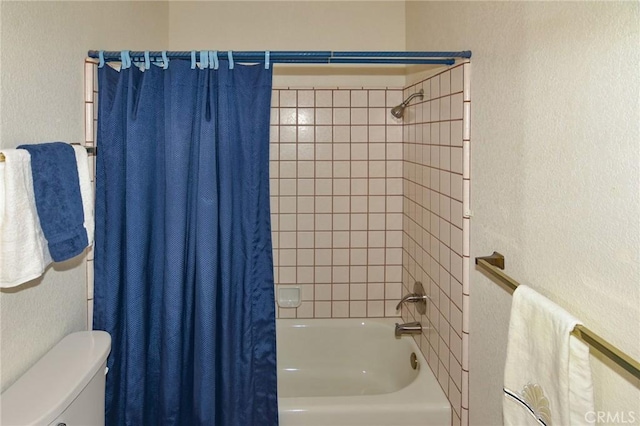 22478 Poppy Rd, Apple Valley, CA 92308 - full bathroom with a textured wall, shower / bath combo, and toilet
