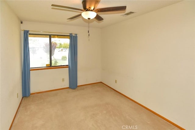 22478 Poppy Rd, Apple Valley, CA 92308 - unfurnished room with ceiling fan, light carpet, and baseboards