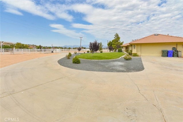 22478 Poppy Rd, Apple Valley, CA 92308 - view of yard featuring driveway and an attached garage