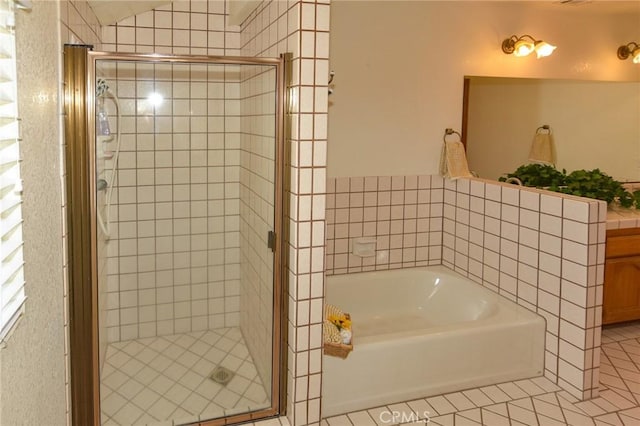 22478 Poppy Rd, Apple Valley, CA 92308 - full bathroom featuring a garden tub, a stall shower, tile patterned floors, and vanity