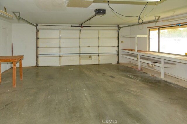 22478 Poppy Rd, Apple Valley, CA 92308 - garage featuring a garage door opener