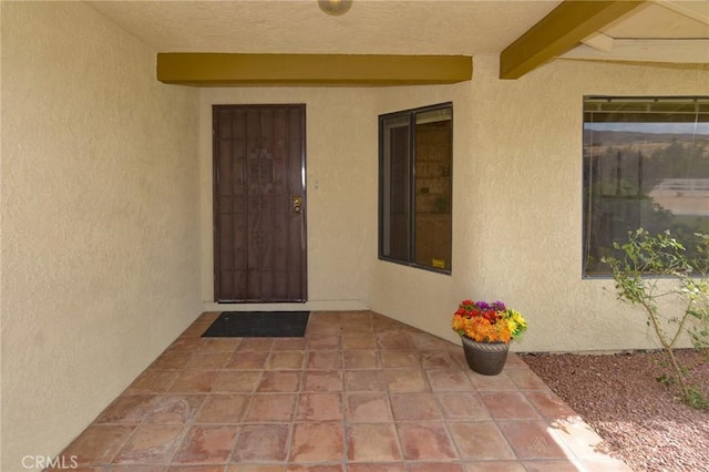 22478 Poppy Rd, Apple Valley, CA 92308 - view of exterior entry with stucco siding and a patio