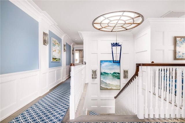 505 W Edgewater Ave, Newport Beach, CA 92661 - staircase featuring a decorative wall, crown molding, and wainscoting