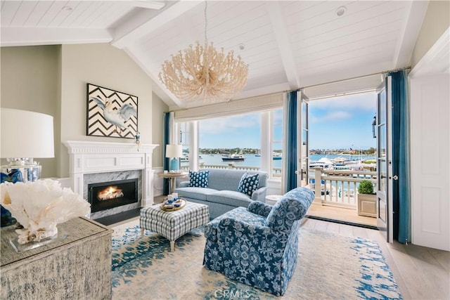 505 W Edgewater Ave, Newport Beach, CA 92661 - living area with a water view, light wood-style flooring, a high end fireplace, wood ceiling, and floor to ceiling windows