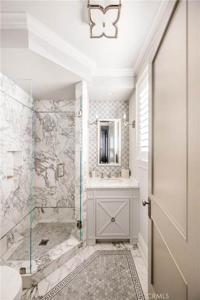 505 W Edgewater Ave, Newport Beach, CA 92661 - full bath with ornamental molding, a marble finish shower, vanity, marble finish flooring, and toilet