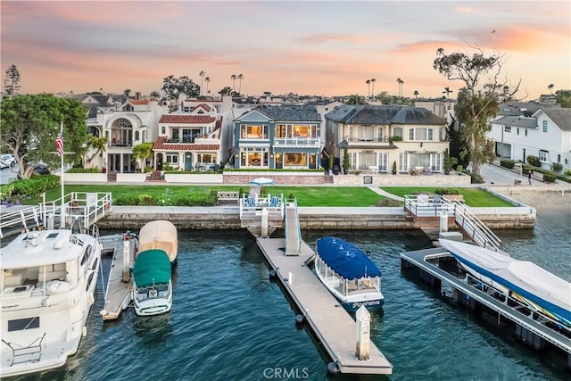 505 W Edgewater Ave, Newport Beach, CA 92661 - dock with a water view, a residential view, and a lawn