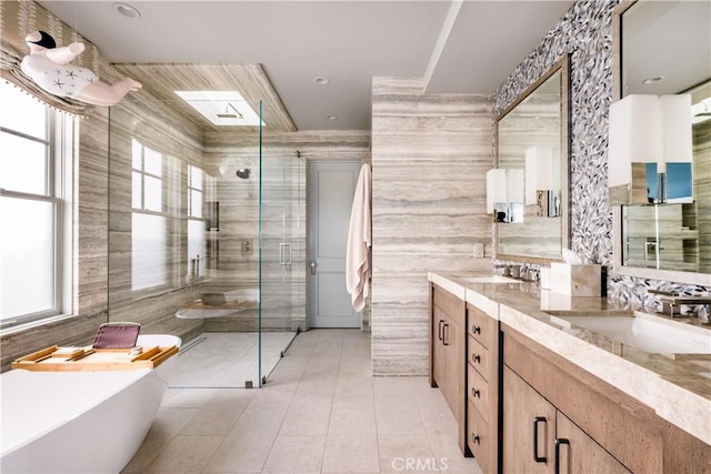 505 W Edgewater Ave, Newport Beach, CA 92661 - full bathroom featuring a stall shower, a freestanding tub, double vanity, tile walls, and tile patterned floors