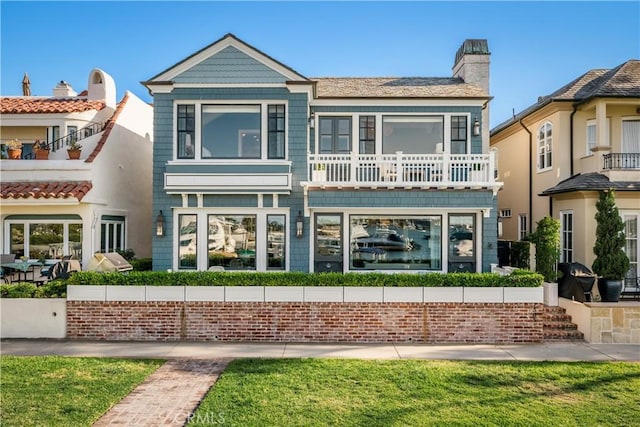 505 W Edgewater Ave, Newport Beach, CA 92661 - back of house with a chimney and a balcony