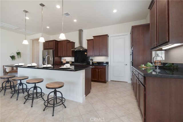 24385 Overlook Dr, Corona, CA 92883 - kitchen with wall chimney exhaust hood, dark countertops, a kitchen bar, an island with sink, and recessed lighting