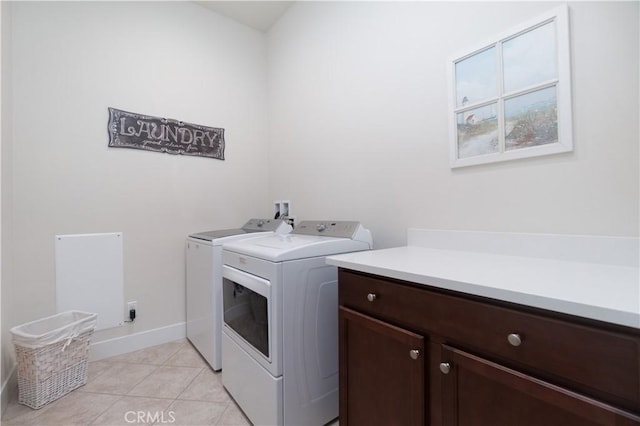 24385 Overlook Dr, Corona, CA 92883 - laundry room featuring independent washer and dryer, cabinet space, and light tile patterned flooring