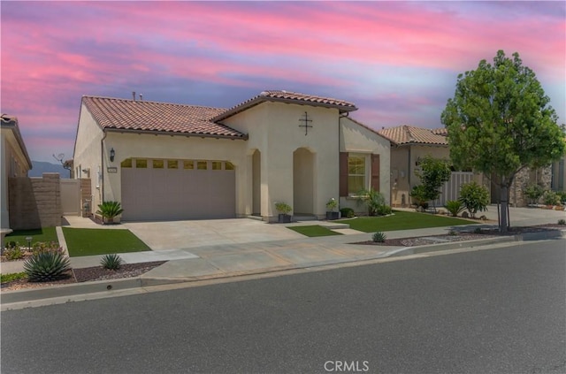 24385 Overlook Dr, Corona, CA 92883 - mediterranean / spanish-style home with a tile roof, stucco siding, an attached garage, and driveway