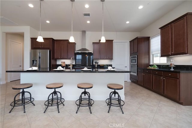 24385 Overlook Dr, Corona, CA 92883 - kitchen featuring wall chimney range hood, stainless steel appliances, dark countertops, a breakfast bar area, and recessed lighting