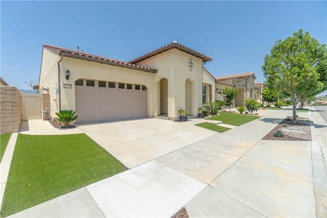 24385 Overlook Dr, Corona, CA 92883 - mediterranean / spanish house featuring stucco siding, concrete driveway, an attached garage, and a tiled roof