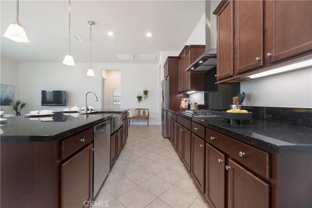 24385 Overlook Dr, Corona, CA 92883 - kitchen with wall chimney range hood, stainless steel appliances, a center island with sink, light tile patterned flooring, and pendant lighting