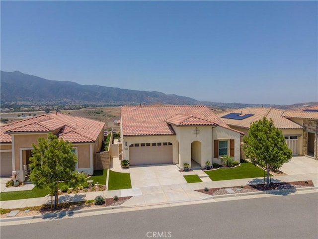 24385 Overlook Dr, Corona, CA 92883 - mediterranean / spanish-style home with driveway, stucco siding, a garage, and a tiled roof