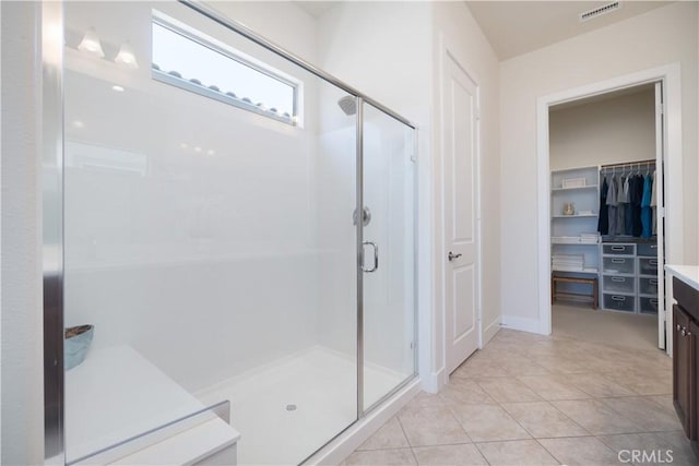 24385 Overlook Dr, Corona, CA 92883 - bathroom with a stall shower, vanity, a spacious closet, and tile patterned floors