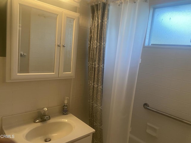 312 Rhodes Ct, Fillmore, CA 93015 - bathroom with tile walls, vanity, and decorative backsplash
