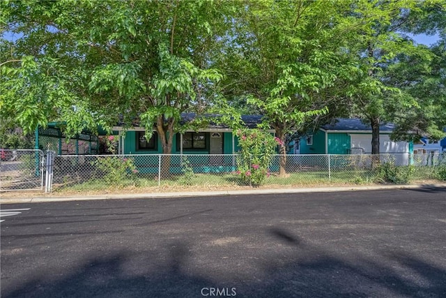 14410 Walnut Ave, Clearlake, CA 95422 - obstructed view of property featuring a fenced front yard and a porch