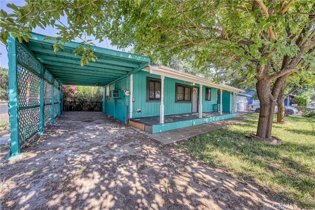 14410 Walnut Ave, Clearlake, CA 95422 - view of front of home featuring asphalt driveway, covered porch, and a carport