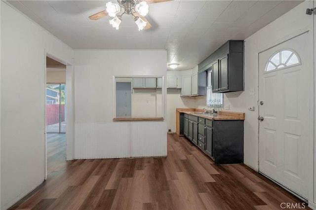 14410 Walnut Ave, Clearlake, CA 95422 - kitchen with ceiling fan, dark wood finished floors, a sink, and gray cabinets