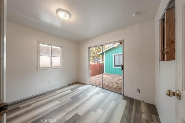 14410 Walnut Ave, Clearlake, CA 95422 - unfurnished room with light wood-type flooring and a smoke detector