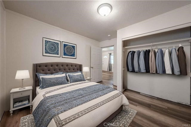 14410 Walnut Ave, Clearlake, CA 95422 - bedroom featuring a closet, ornamental molding, and wood finished floors