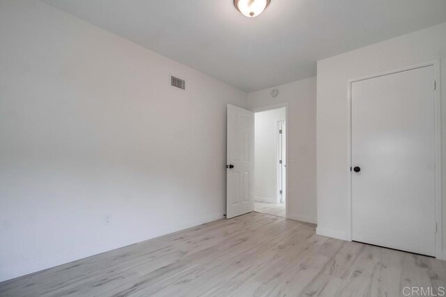 1125 Evilo St, El Cajon, CA 92021 - unfurnished bedroom featuring light wood-style flooring