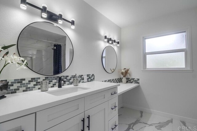 1125 Evilo St, El Cajon, CA 92021 - bathroom with marble finish flooring, vanity, decorative backsplash, and curtained shower