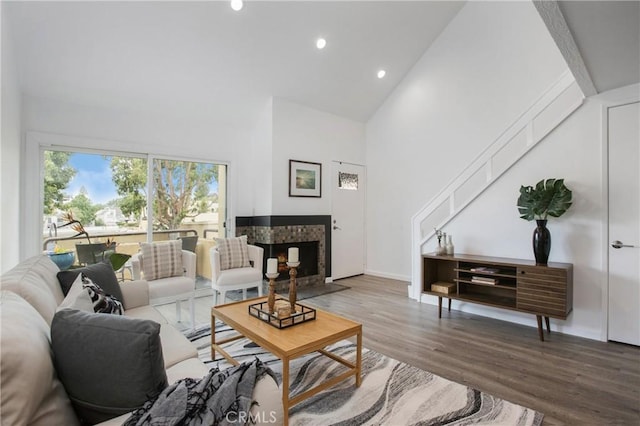 25712 Le Parc Unit 40, Lake Forest, CA 92630 - living room featuring high vaulted ceiling, recessed lighting, a tile fireplace, wood finished floors, and baseboards