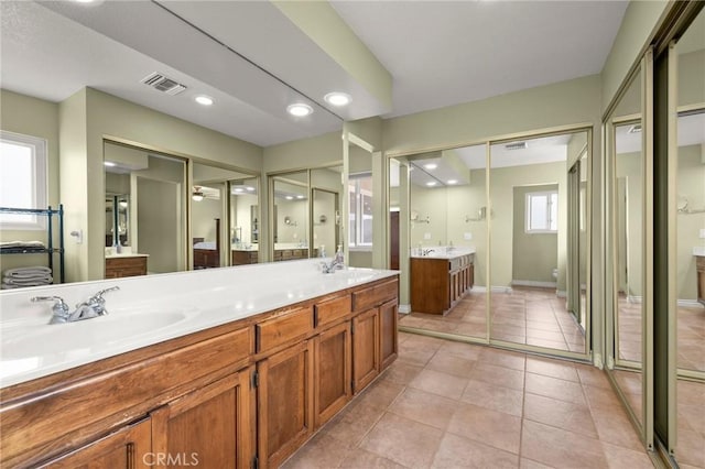 35122 Red Rover Mine Rd, Acton, CA 93510 - bathroom featuring double vanity, tile patterned flooring, and recessed lighting