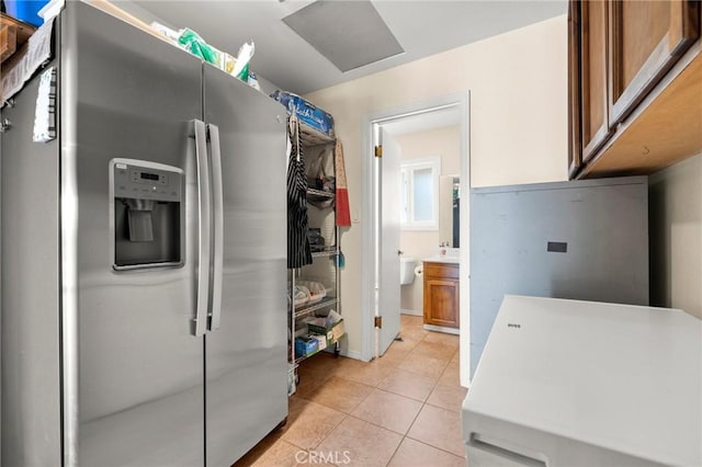 35122 Red Rover Mine Rd, Acton, CA 93510 - kitchen featuring stainless steel fridge, light tile patterned flooring, brown cabinets, and light countertops