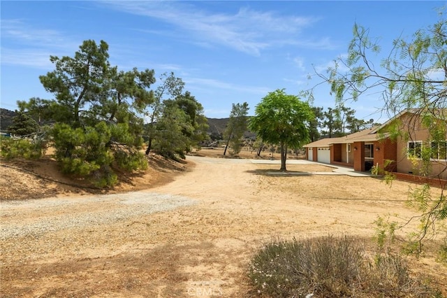 35122 Red Rover Mine Rd, Acton, CA 93510 - view of yard with driveway and an attached garage