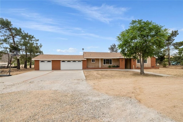 35122 Red Rover Mine Rd, Acton, CA 93510 - ranch-style home featuring driveway, an attached garage, and brick siding