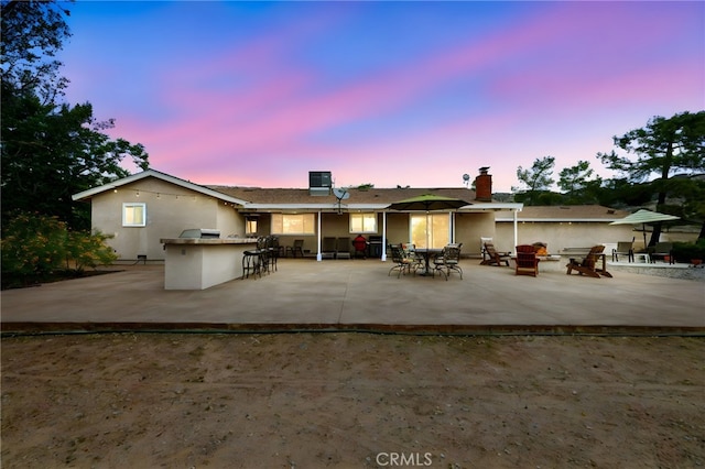 35122 Red Rover Mine Rd, Acton, CA 93510 - back of house with an outdoor fire pit, a patio area, stucco siding, and a chimney